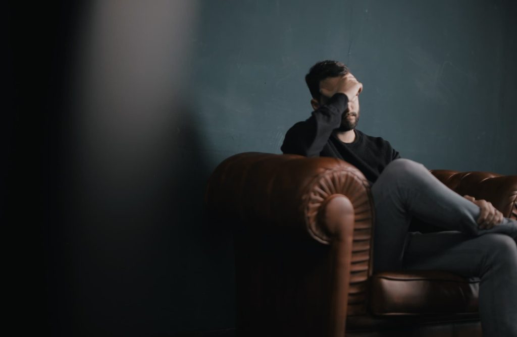 man stressed sitting in a chair